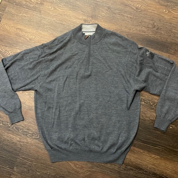 Peter Millar 3/4 zip neck with Sea Island Golf course logo on sleeve
